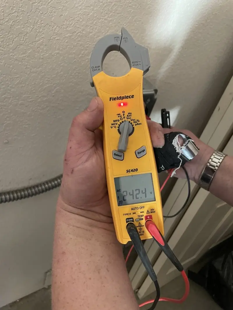 Voltage testing with clamp meter during Circuit Breaker Repair in Farmingdale